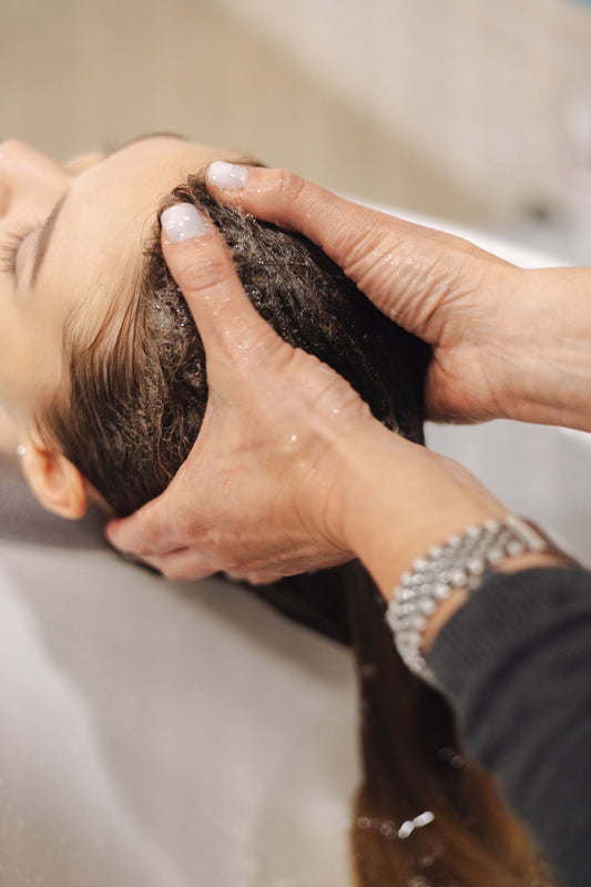 Person receiving a relaxing scalp and head massage